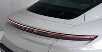 The rear design boasts a seamless light strip and 'PORSCHE' logo made of three-dimensional letters in a glass look