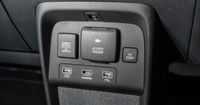 Multiple connection inputs are provided beneath the centre console for easy charging and connection of devices